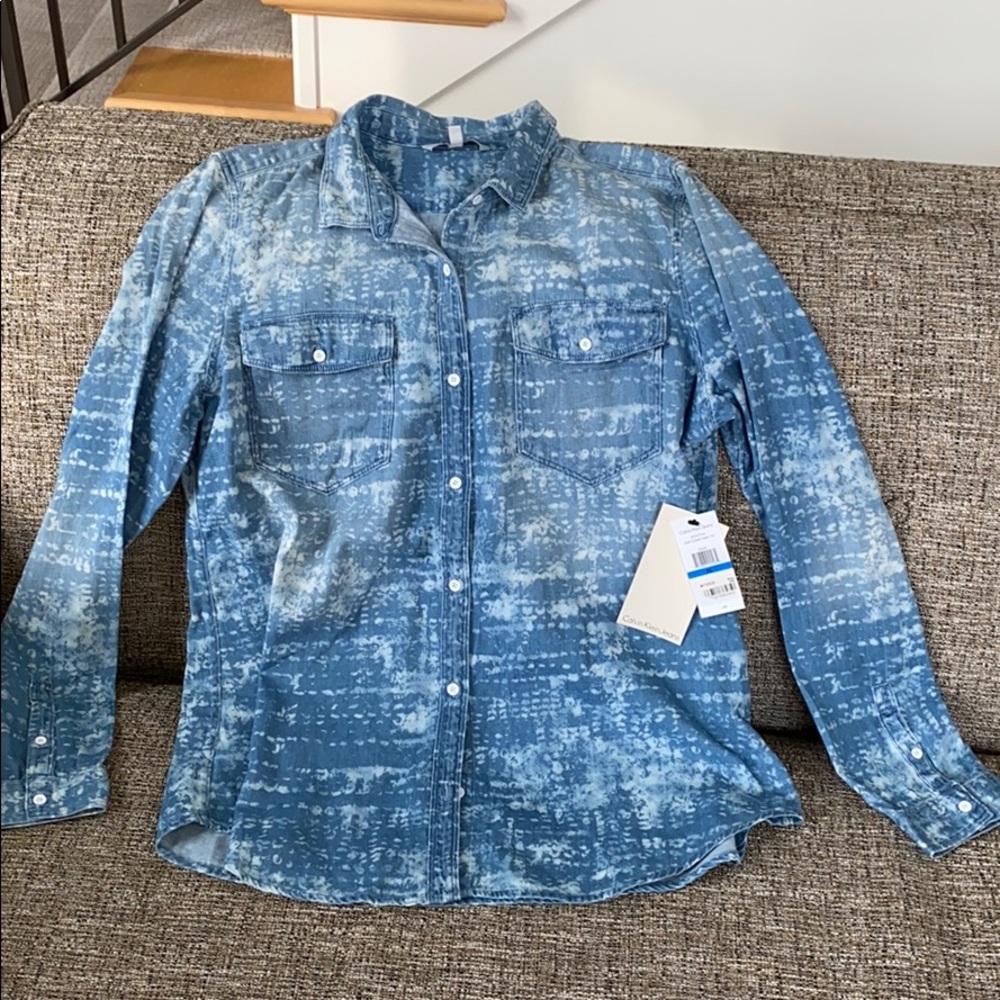 Women’s Calvin Klein Denim button up shirt.